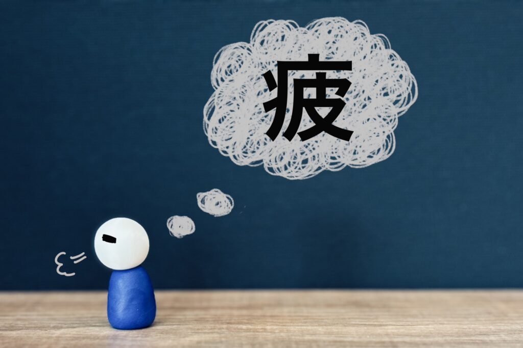 疲れてため息をしている表現